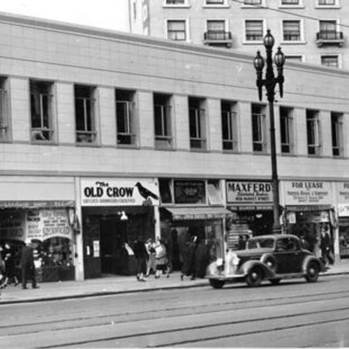 [Exterior of the Dean Building at Market and Turk streets]