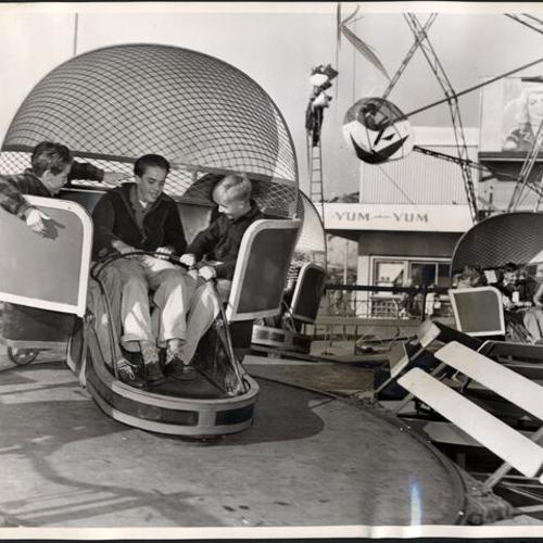 [Boys enjoying one of the many rides at Playland at the Beach]