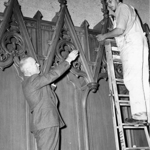 [Rev. Bernard H. Lovgren and carpenter William Ley inside Grace Cathedral]