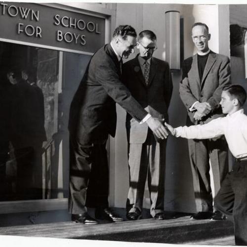 [Mayor George Christopher, Dr. Edwin Rich, Rev. Edward A Wicher and Pat McBaine during dedication ceremonies of Town School for Boys]