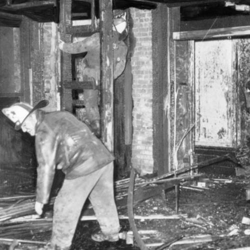 [Firemen in the Italian Room of the St. Francis Hotel after a fire]
