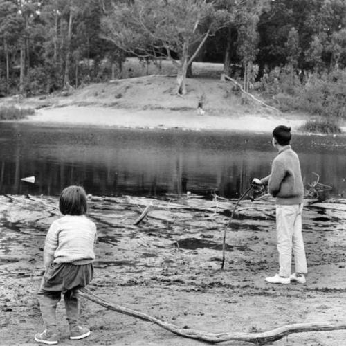 [Two children playing on the hazardous shores of Mountain Lake]