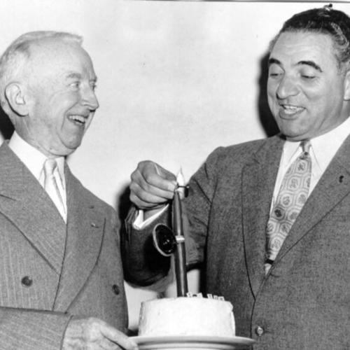 [Chief Administrative Officer Thomas A. Brooks receiving a birthday cake from Mayor Christopher]