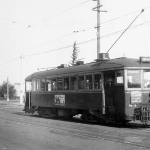 ["L" streetcar heading west on Taraval Street at 36th Avenue]