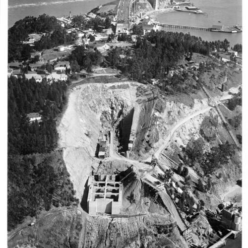 [Aerial view looking eastward of Yerba Buena Island span and bore tunnel under construction for San Francisco-Oakland Bay Bridge while East Bay Crossing span being built in the background]