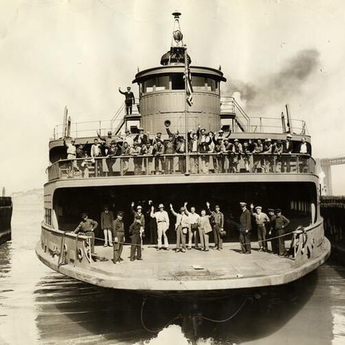 [Captain H.F. Strother and passengers wave as ferryboat "Alameda" leaves the dock]
