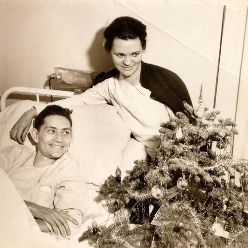 [Patient John Taber and nurse Dorothy Johnson on Christmas day at Letterman General Hospital]