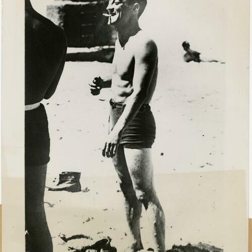 Buster Keaton standing at the beach in Biarritz, France