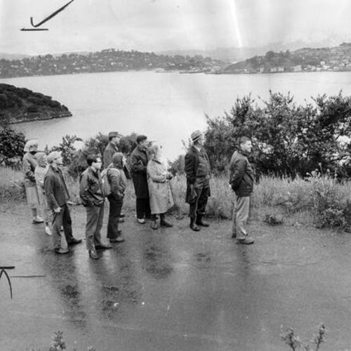[Group of people exploring "badly rundown" Angel Island]