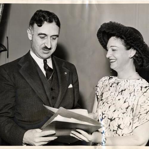 [Lloyd W. Dinkelspiel and Mrs. Mortimer Fleishhacker, Jr.discussing campaign plans for the 1946 Jewish National Welfare Fund drive]
