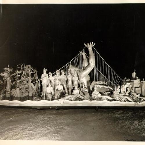 [Golden Gate Bridge Fiesta Parade float featuring women dressed up as mermaids surrounding a sculpture of Neptune]