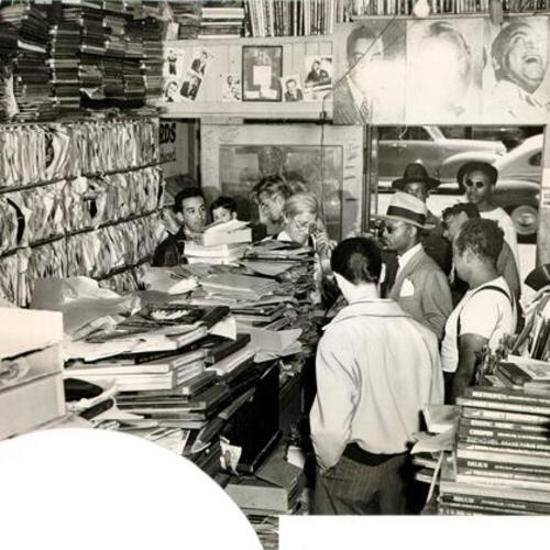 [Group of people in The Record Exchange at 172 Eddy Street]