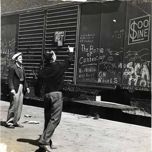 [I. L. W. U. pickets playing handball against the side of a "hot" railroad car during warehousemen's strike]