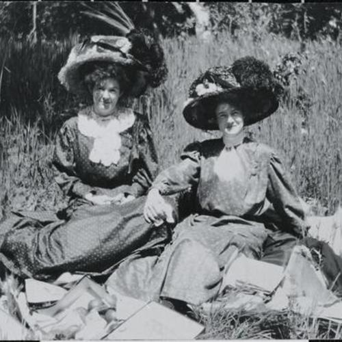 [Portrait of two women in their backyard and home on Treat Street]