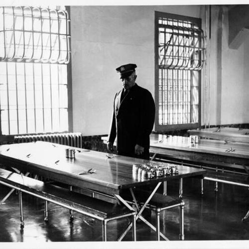 [Alcatraz Island prison guard inspecting dining hall]