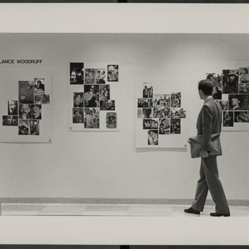 Person looking at Lance Woodruff photograph collage on display at Lurie Building