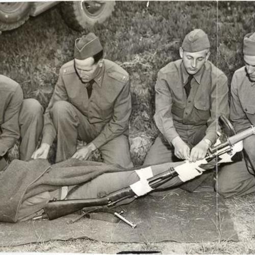 [Four soldiers applying first aid to Private Edward Wax during Red Cross training at the Presidio]