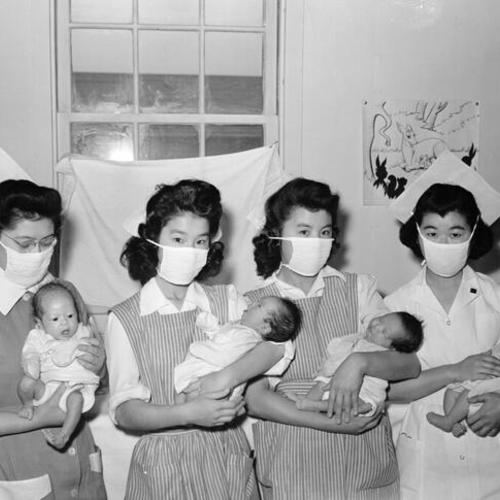 [Nurses holding newborns at Tule Lake Relocation Center]