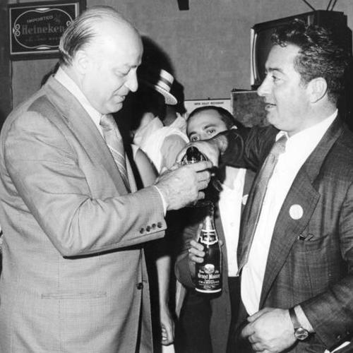 [Joseph Alioto drinks champagne with constituent during campaign]