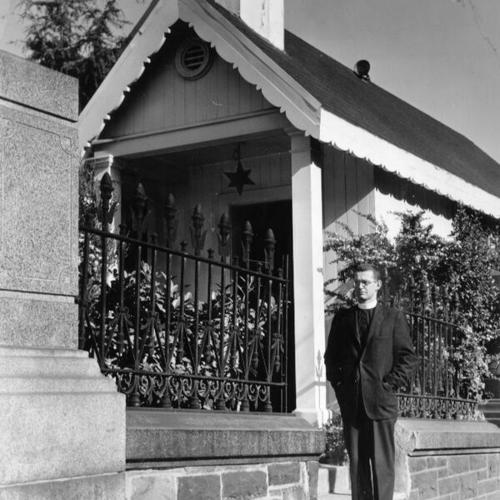 [Canon David Forbes standing outside the Wayside Shrine of St. Francis at Grace Cathedral]