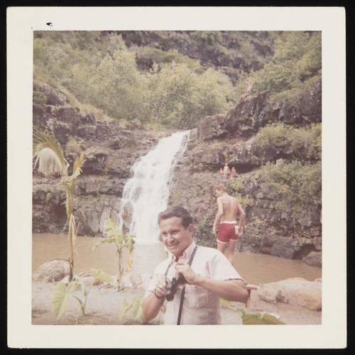 People at waterfall in Hawaii