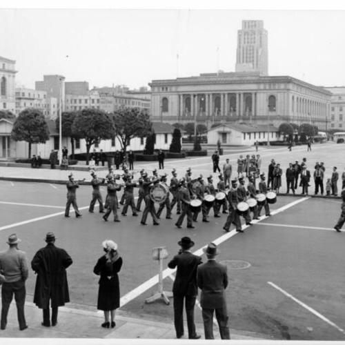  Municipal Railway Drum and Bugle Corps marching in a parade along  the Civic Center]