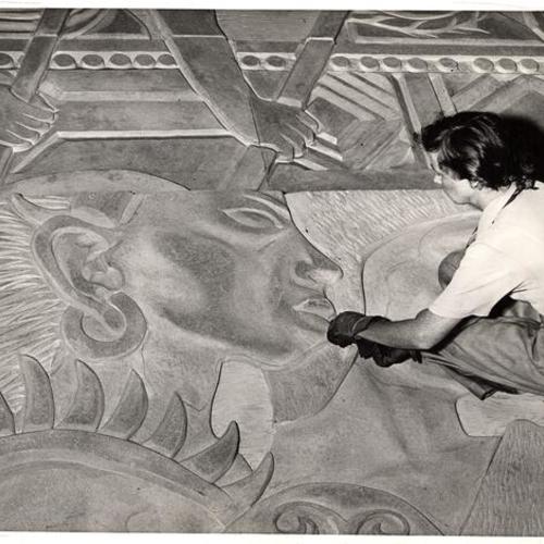 [Artist Esther Bruton working on the mural 'Peacemakers' that will decorate the West walls of the Court of Pacifica, Golden Gate International Exposition on Treasure Island]