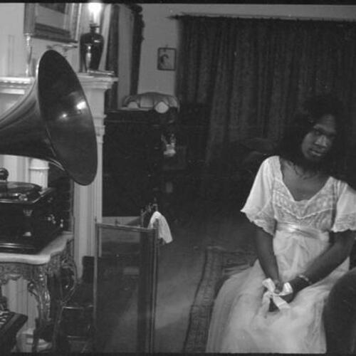 Sylvester sitting in front of Victor Talking Machine in Peter Mintun's house, Mountain View