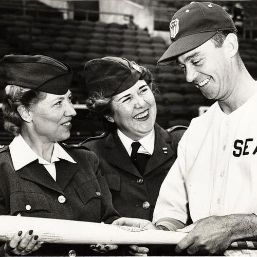 [American Women's Voluntary Services volunteers Mrs. Foster Stewart and Mrs. Helen Park, and Del Young Seals' second baseman planning the AWVS benefit game between San Francisco and Seattle]