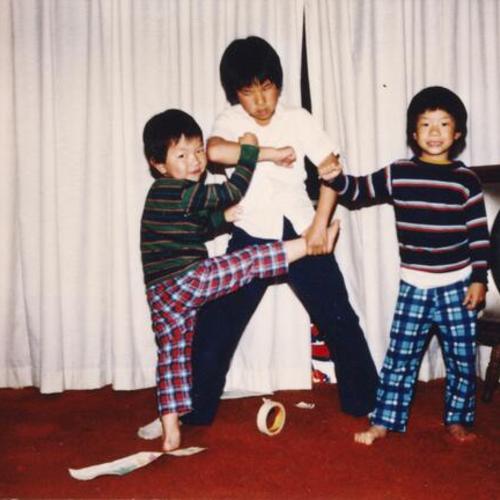 [Gary's sons Donald, Brian and Roger playing and attempting martial arts moves]