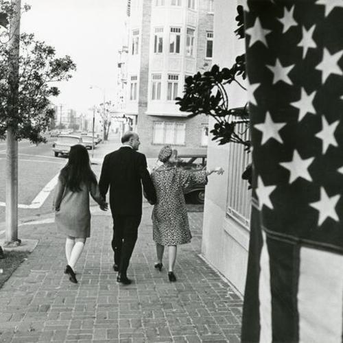 [Joseph Alioto walking with wife Angelina (R) and daughter Angela]