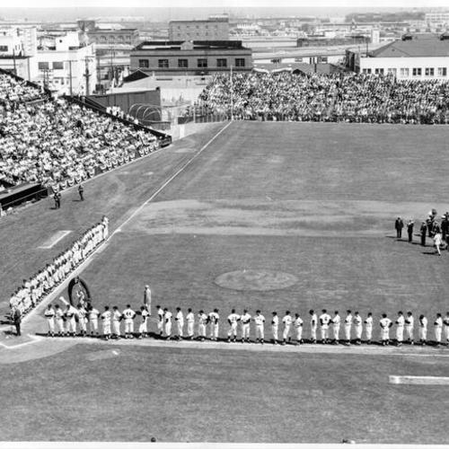 [San Francisco Giants and another team on the field during a ceremony prior to a game at Seals Stadium]