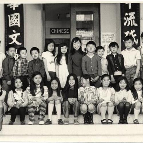 [Group of Chinese children posing on the steps of Immigrants Development Center of San Francisco at 843 Stockton Street]