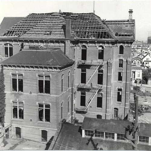 [Workmen demolishing Cogswell Polytechnical School building at Folsom and Army streets]