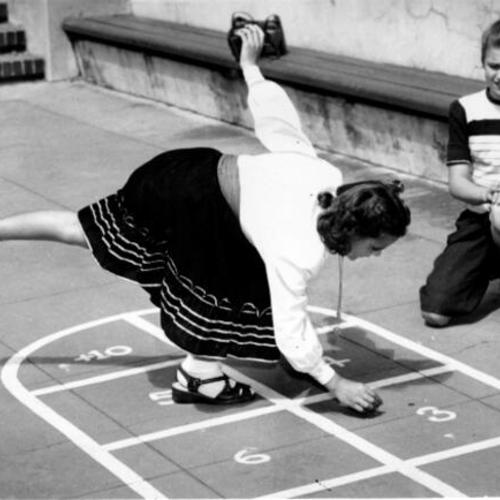 [Evangeline Powell and Dolores Wheeler playing hopscotch at Everett Junior High School]
