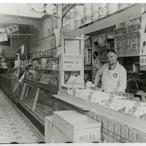 [Owner, George, working at his store, Eagle Market, located 1312 Fillmore Street]