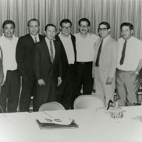 [Miguel and other board members at Arriba Juntos board meeting]