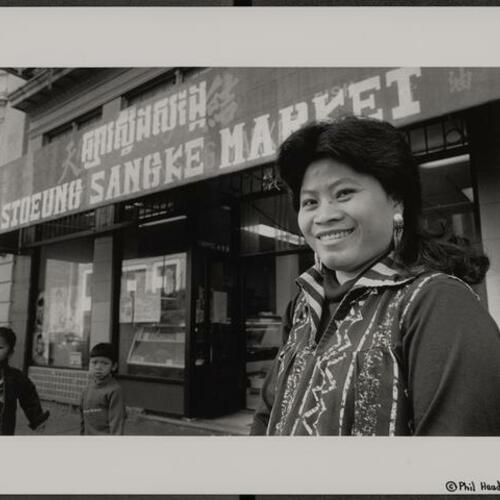 Cambodian refugee grocery store owner Lany Wong outside of her new store
