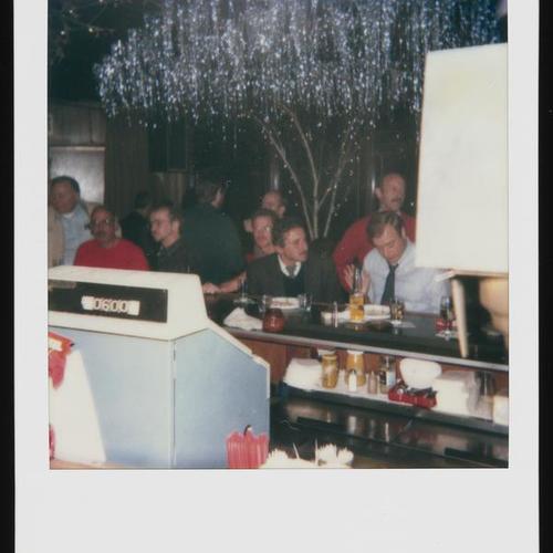 View behind bar, with people seated