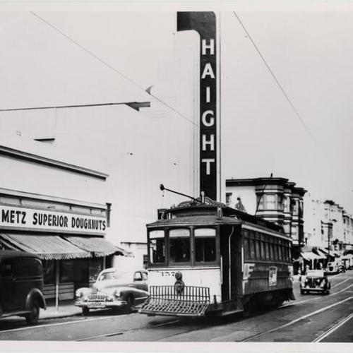[Street car passing in front of the Haight Theater at Cole and Haight Streets]