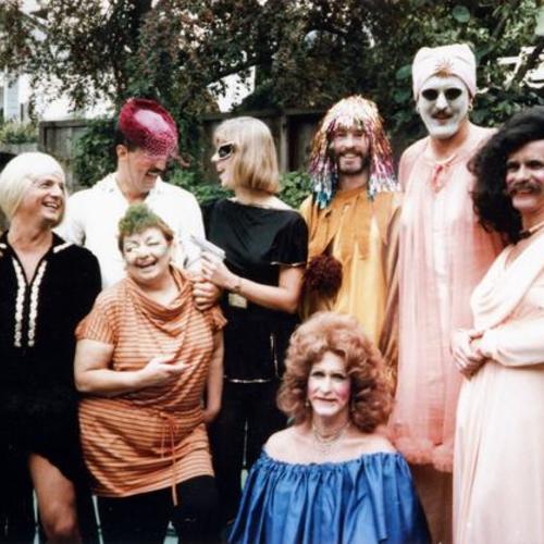 [Halloween and Ron's backyard with friends dressed up in costumes]