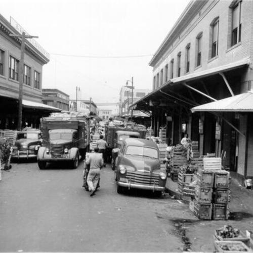 [Deliveries being made to produce markets on Washington Street]