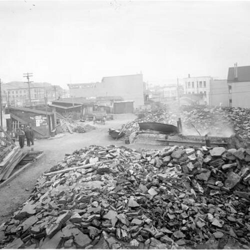 [Aftermath rubble from 1906 earthquake, collected at Market Street at Church]