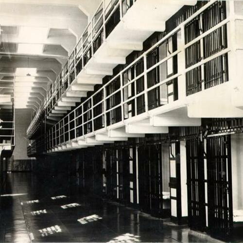 [Row of triple-decked cell blocks in Alcatraz Prison]