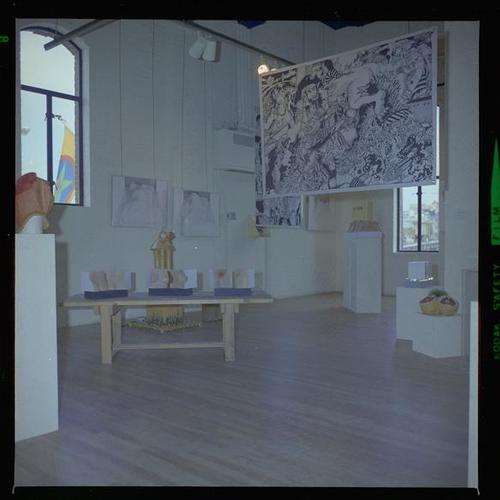 View of gallery interior with art on display
