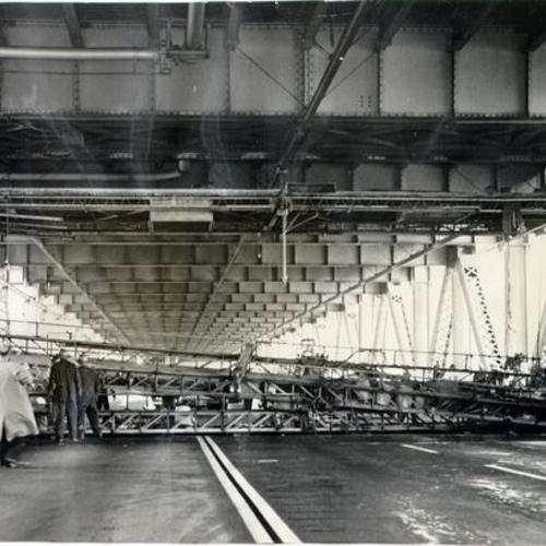 [Lower deck of the San Francisco-Oakland Bay Bridge blocked after an accident involving three large mobile scaffolds]