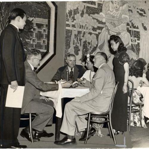 [Unidentified people seated in the Chinese Sky Room nightclub]