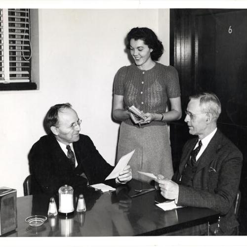 [Dr. Walter C. Eells, Cynthia Richardson and Dr. A.J. Cloud in the San Francisco Junior College faculty dining room]