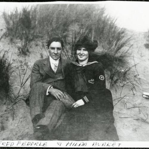 [Hilda and Fred sitting together on sand dunes in Parkside neighborhood]