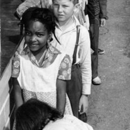 [Children lined up at water fountain at Ridgepoint School]